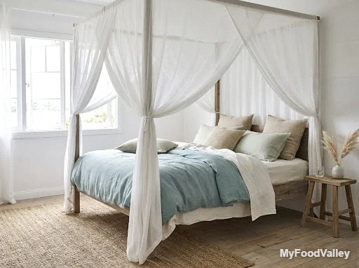 a gauzy white canopy bed