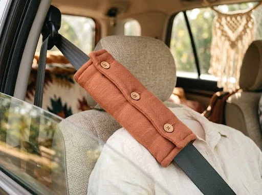 terracotta-toned seatbelt cushion